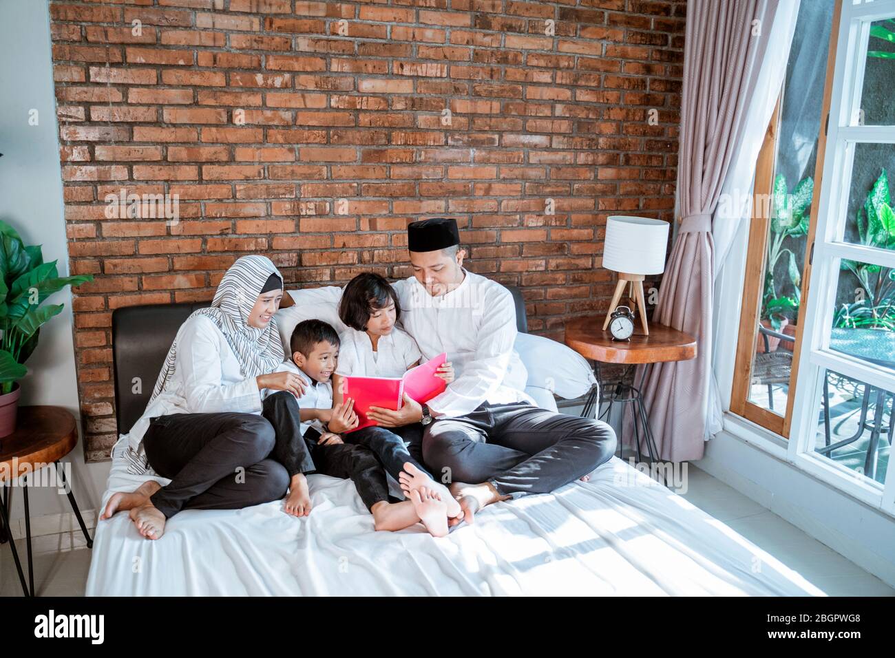 Boy reading the quran hires stock photography and images Alamy