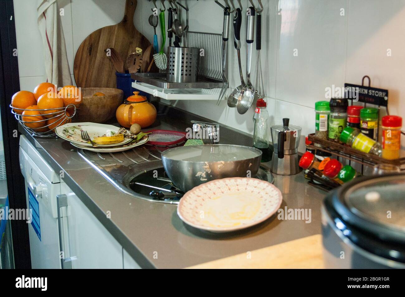 Sink full of dirty dishes Stock Photo