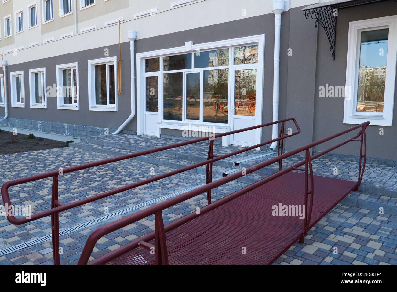 Wheelchair access ramp for entrance of residential multistory building