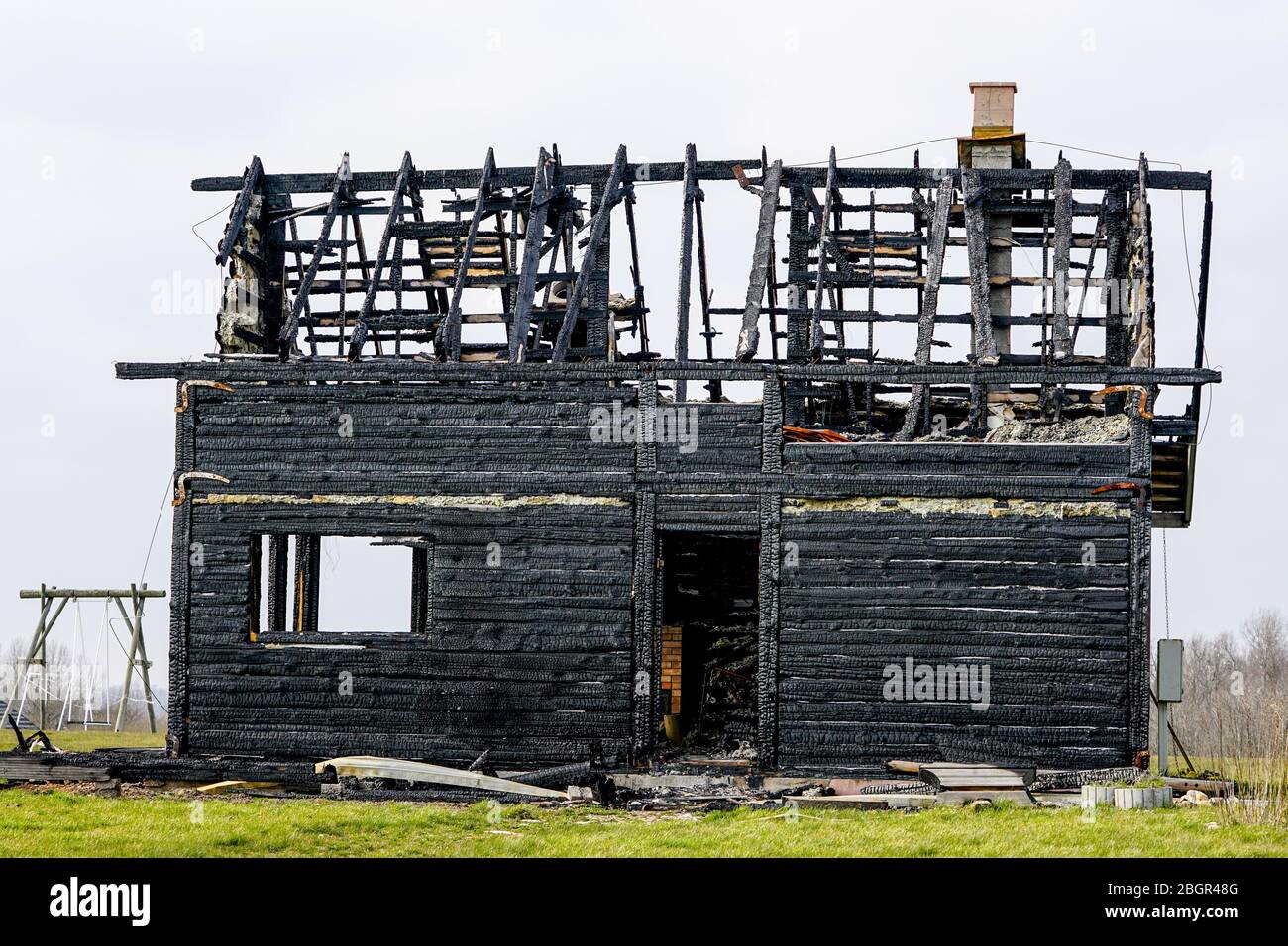 burnt down two storey wooden house in rural area Stock Photo Alamy