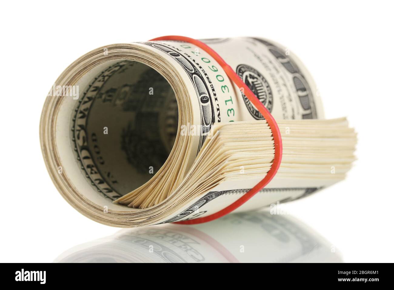 A lot of one hundred dollar bills tied rubber band isolated on white ...