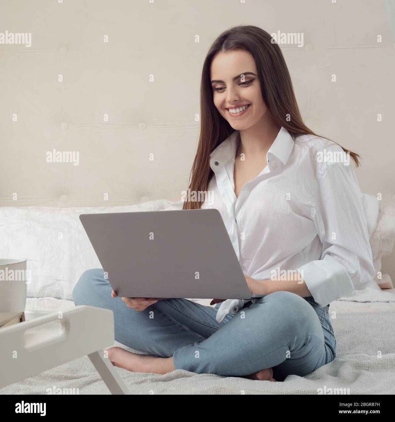 Girl working from home on laptop during Covid19 quarantine Stock Photo