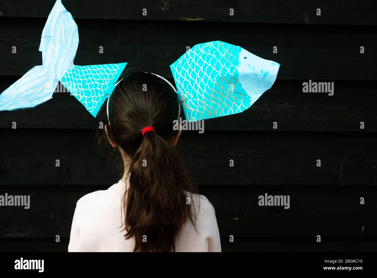 7-year old girl home schooled art class fish Stock Photo