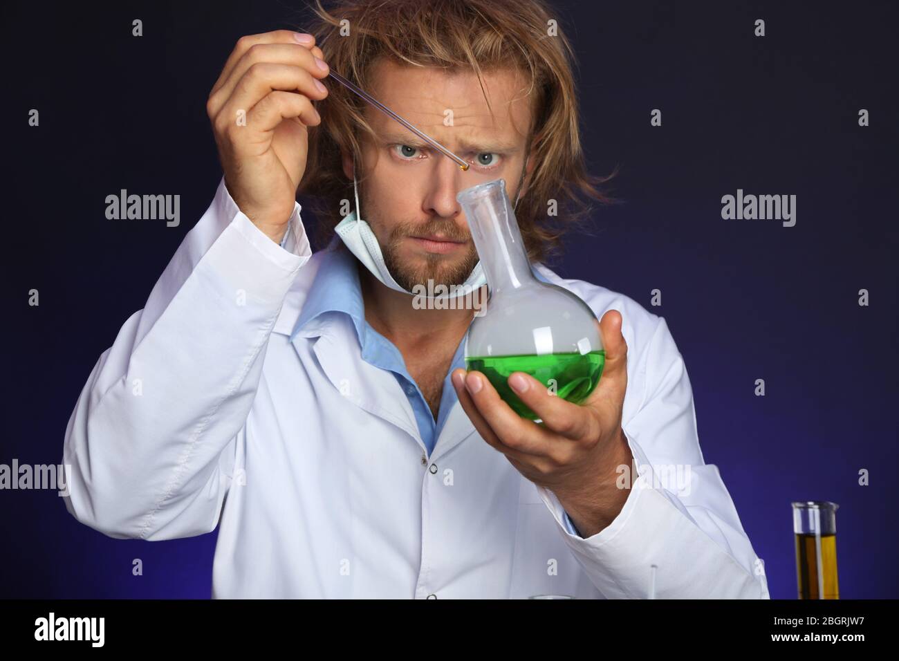 Crazy scientist working in laboratory Stock Photo