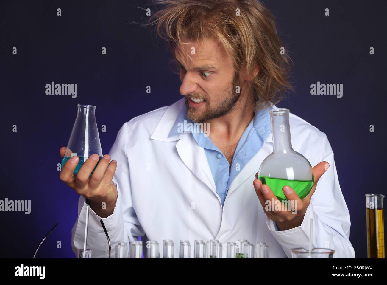 Crazy scientist working in laboratory Stock Photo