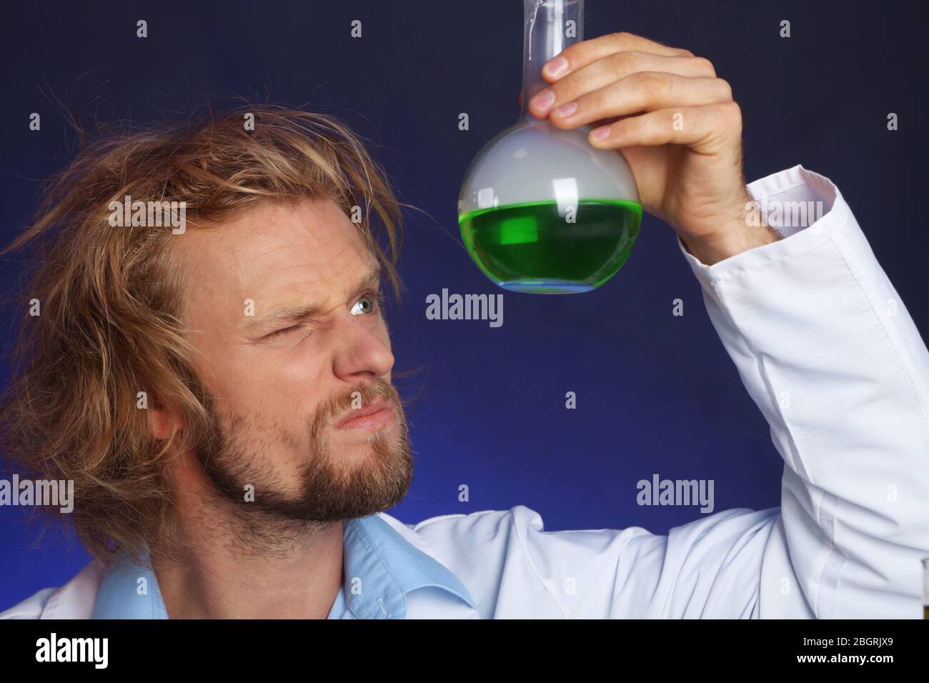 Crazy scientist working in laboratory Stock Photo