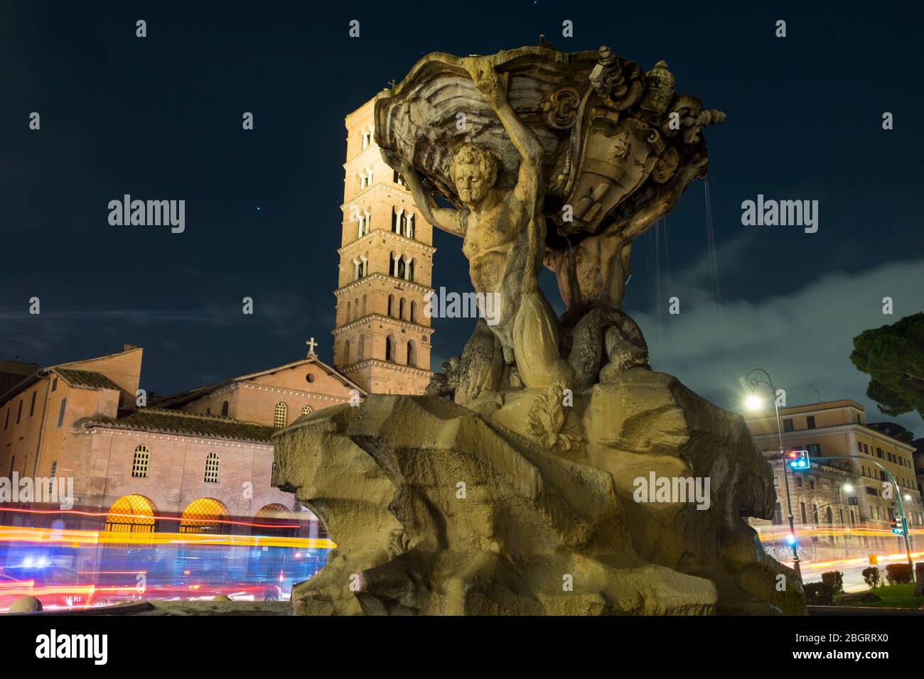 Italy, Rome, Fountain of tritons and the church of Santa Maria in Cosmedin. Stock Photo