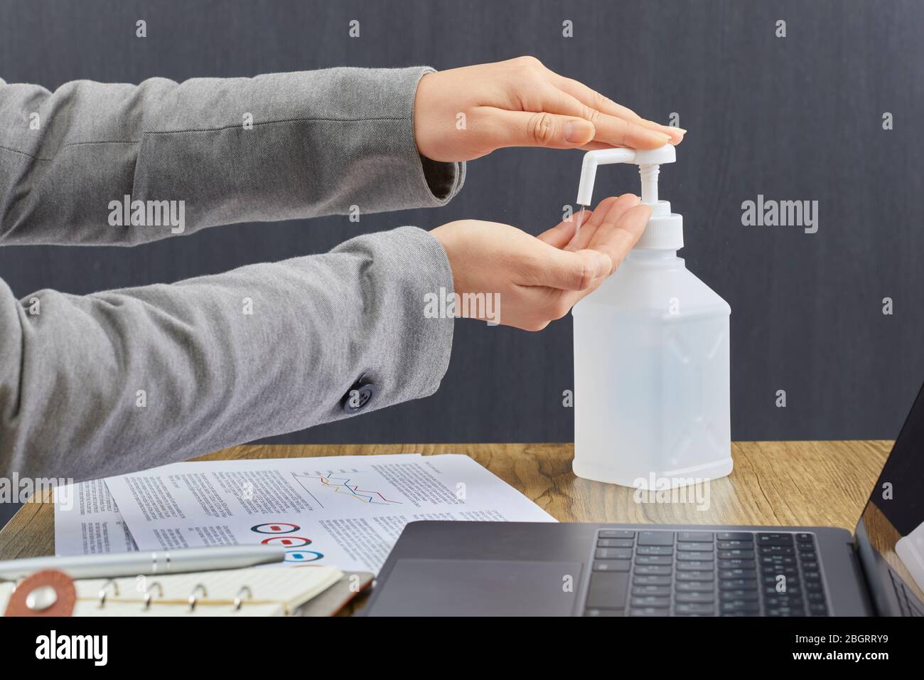 Disinfecting hands with alcohol Stock Photo - Alamy