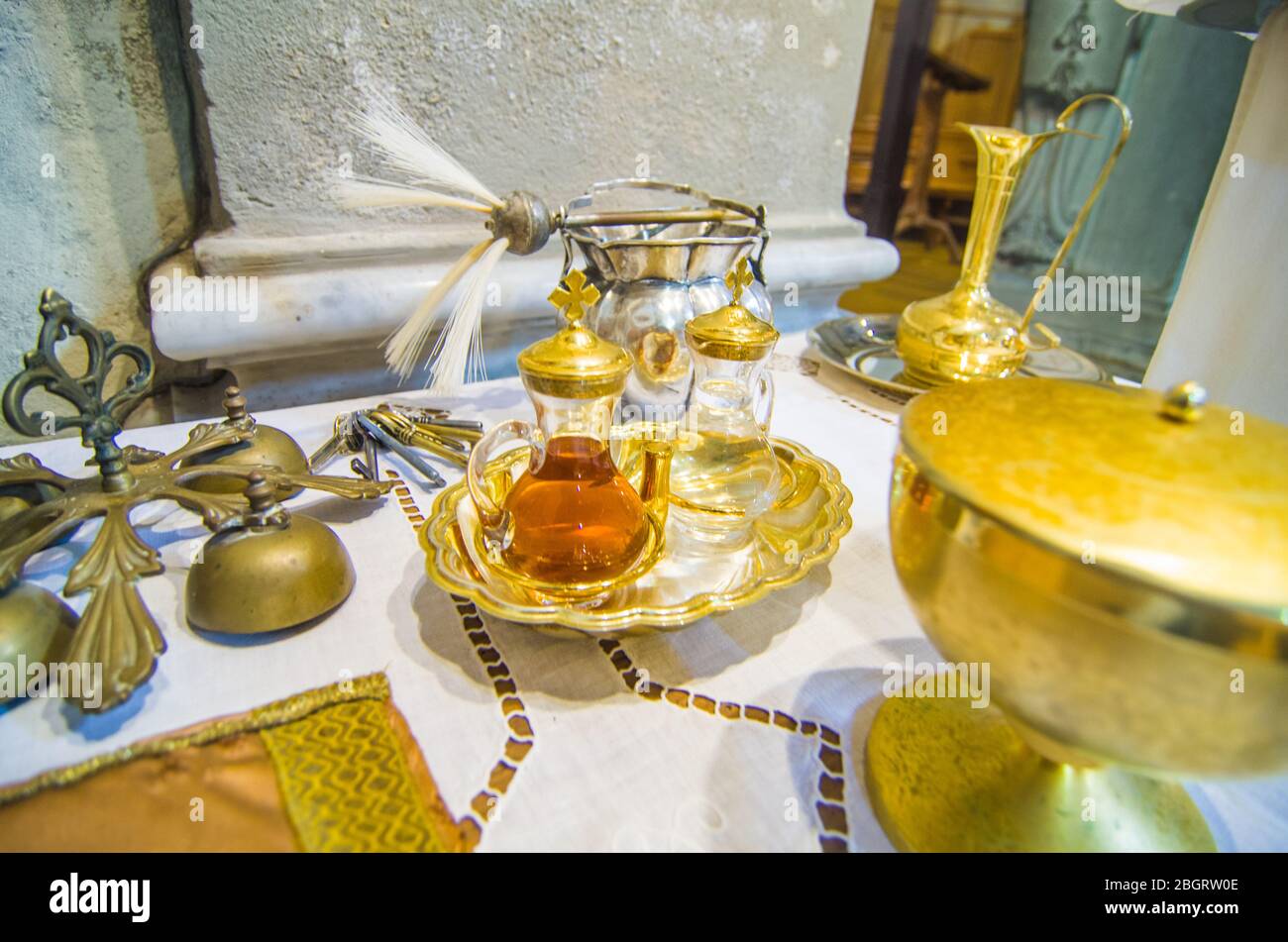church altar with small wine vial ready to the blood of jesus