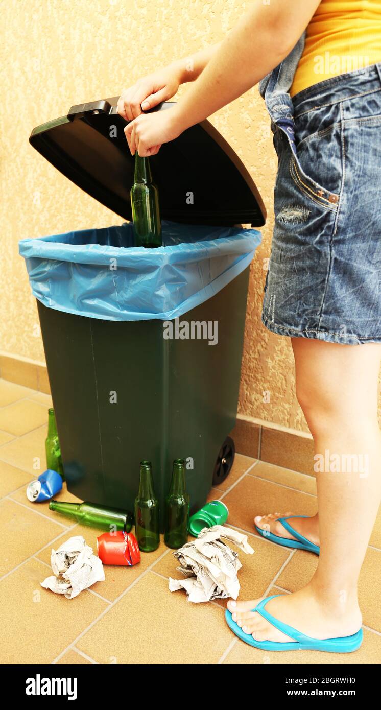 Recycling bin on wall background Stock Photo - Alamy