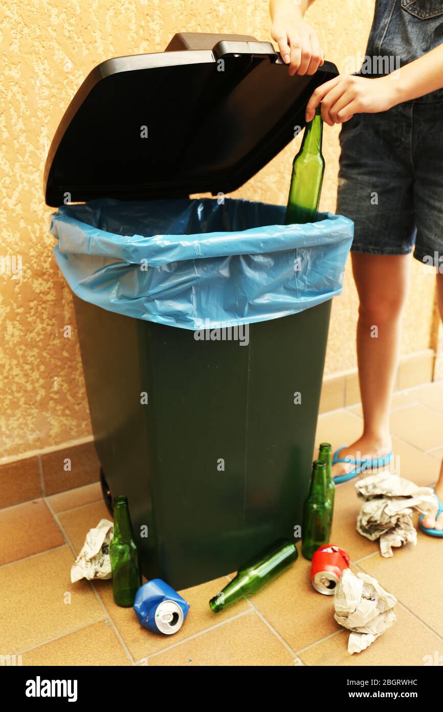 Recycling bin on wall background Stock Photo - Alamy