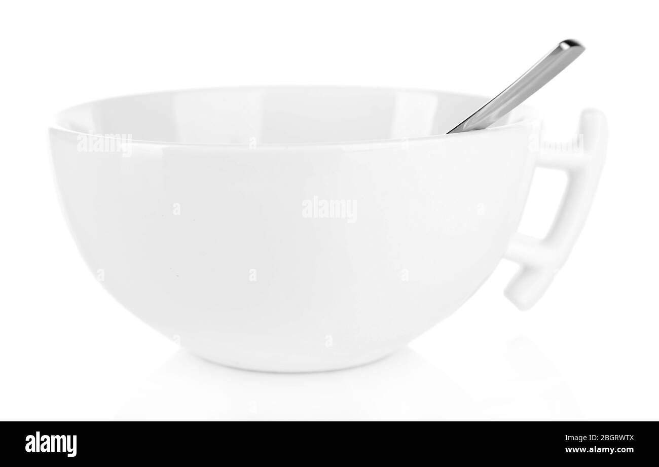 Empty cup with tea spoon isolated on white Stock Photo Alamy