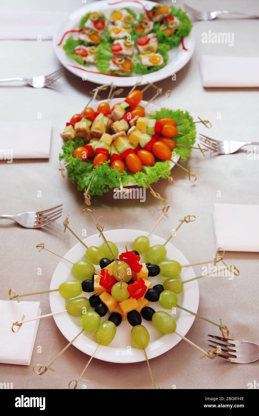 Restaurant table setting with tasty food Stock Photo - Alamy