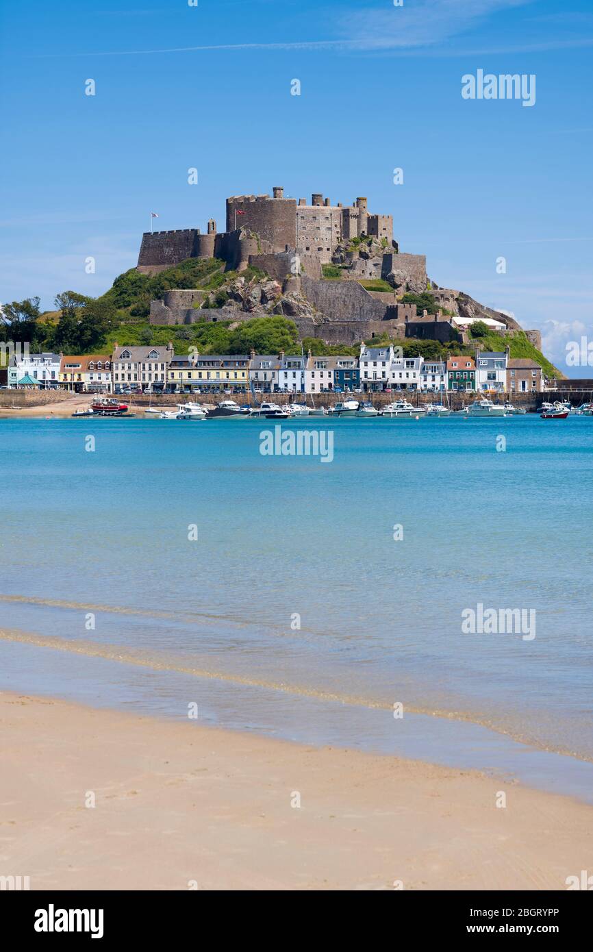 Mount Orgueil Castle overlooking the harbour and bay at Gorey on the east coast of Jersey, Channel Isles Stock Photo