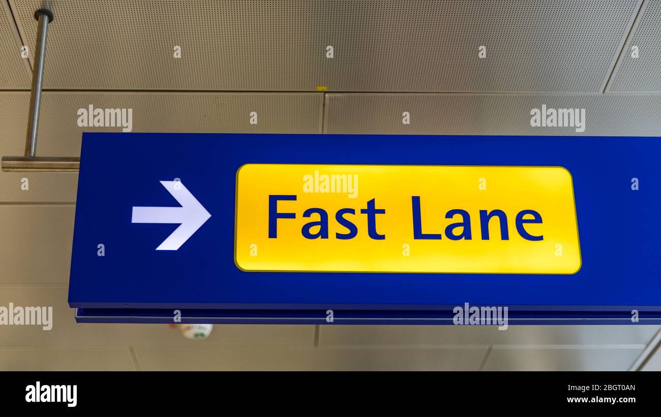 Fast Lane sign in blue and yellow at the airport close up. Fast Lane ...