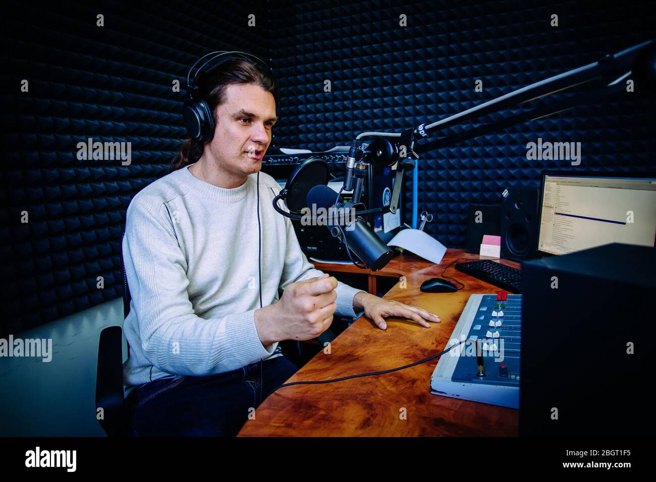 Talking male radio presenter in radio station Stock Photo - Alamy