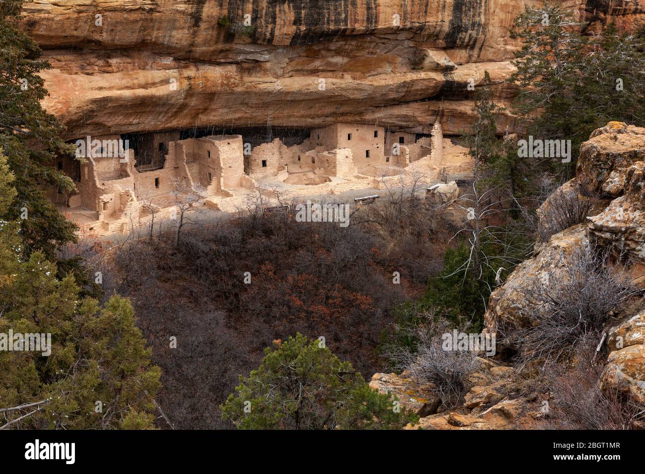 CO00231-00...COLORADO - Spring snow storm at cliff dwellings of the Ancestral Pueblo People called Spruce Tree House in  Mesa Verde National Park. Stock Photo