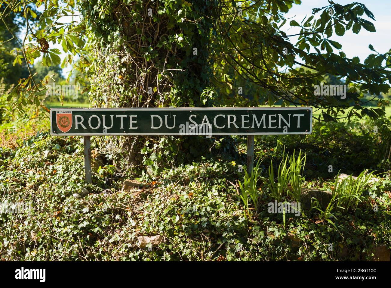 Route du Sacrement, French road name sign in St Saviour region of Jersey, Channel Isles Stock Photo
