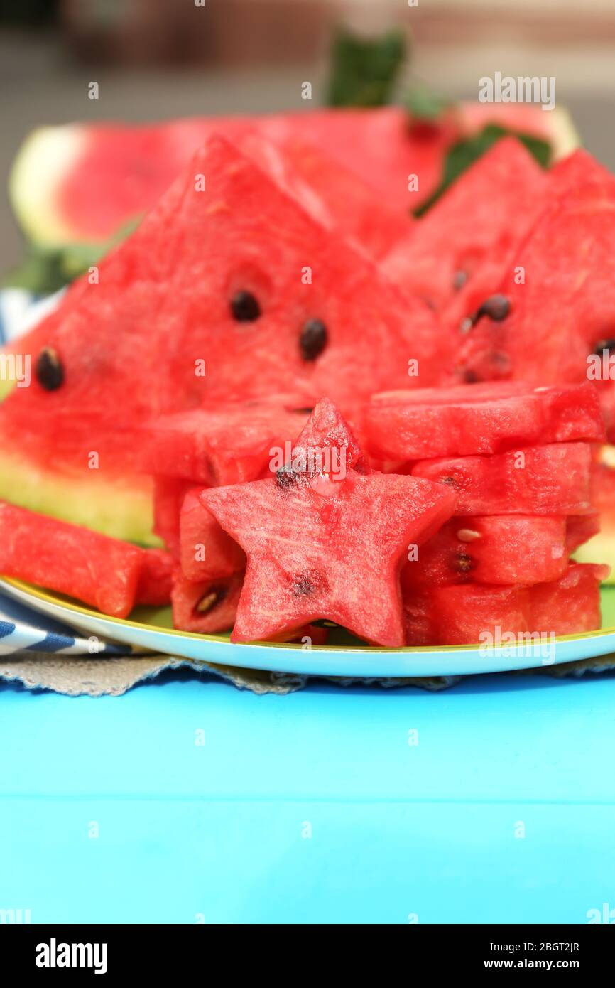Fresh slices of watermelon on table, outdoors Stock Photo