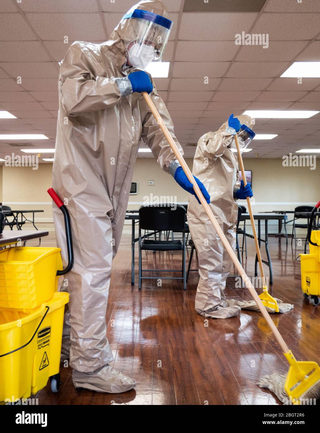 Georgia National Guard soldiers mop a floor while conducting COVID-19 infection control procedures at an assisted living facility in Macon, GA. (USA) Stock Photo