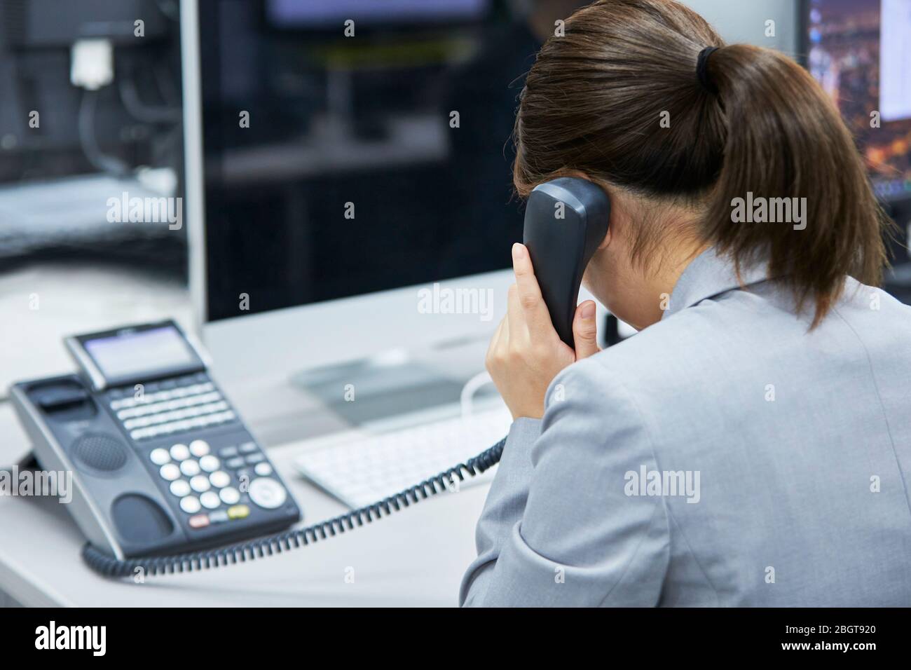 Woman phone receiver rear view hi-res stock photography and images - Alamy
