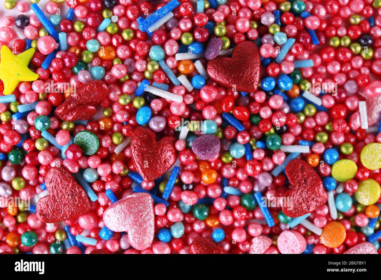 Colorful sugar sprinkles background Stock Photo - Alamy
