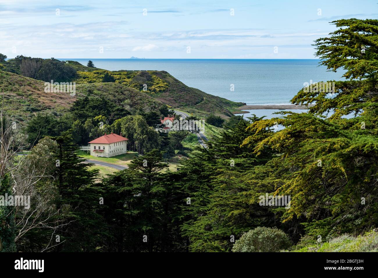 Landscape with coastal buildings just inland from Pacific Ocean Stock Photo
