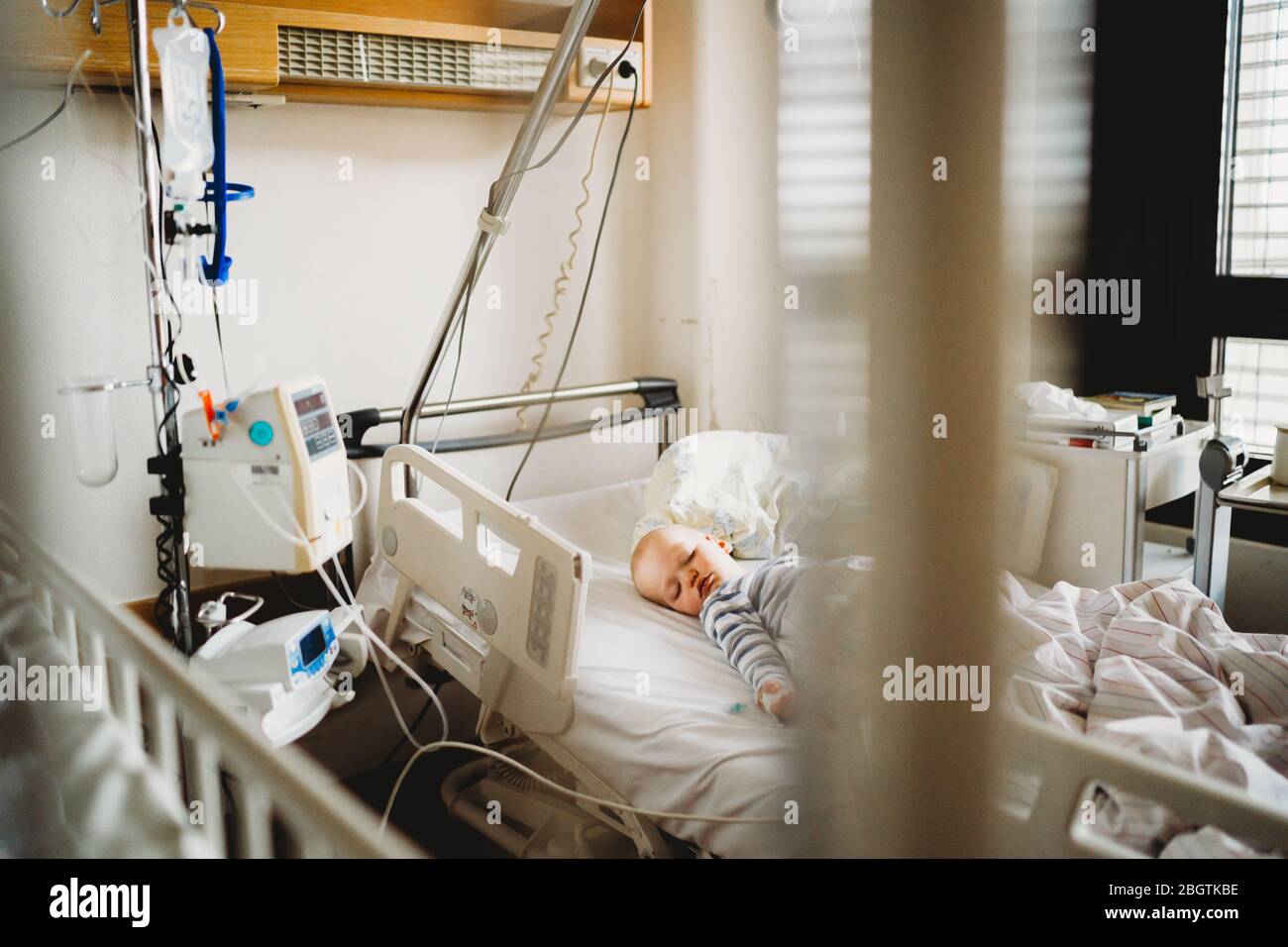 Baby child sick at the hospital with a virus coronavirus Stock Photo