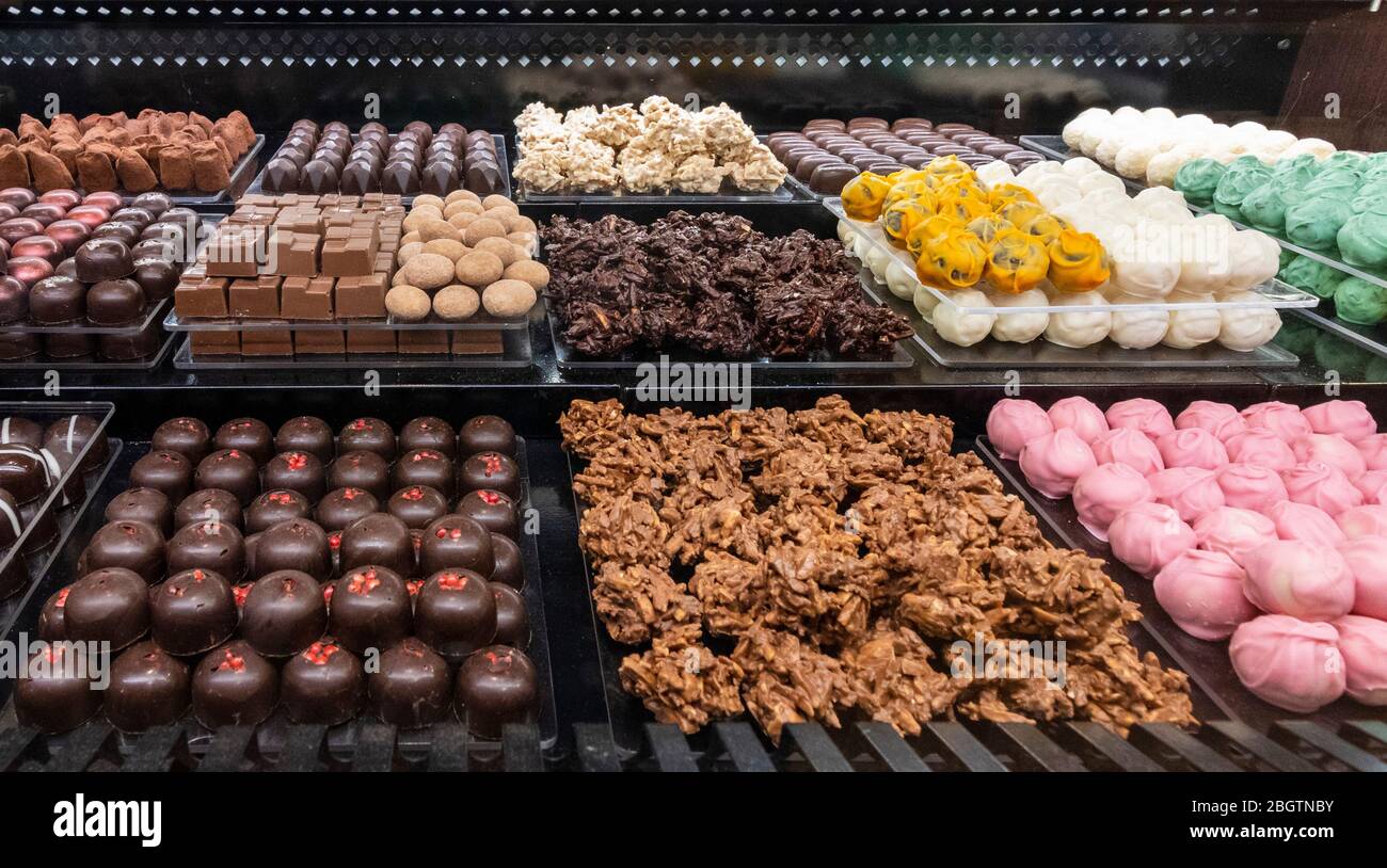Different coloured chocolates ready to buy Stock Photo Alamy