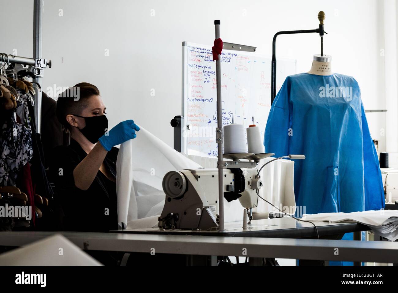 Brooklyn, United States Of America . 22nd Apr, 2020. A seamstress sews reusable hospital gowns for frontline healthcare workers at Malia Mills, a fashion garment factory in Industry City in Brooklyn, New York, on April 22, 2020. (Photo by Gabriele Holtermann-Gorden/Sipa USA) Credit: Sipa USA/Alamy Live News Stock Photo