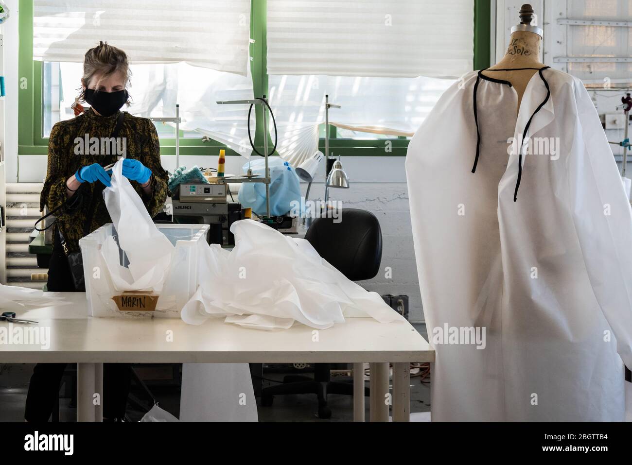 Brooklyn, United States Of America . 22nd Apr, 2020. A seamstress prepares the fabric for reusable hospital gowns for frontline healthcare workers at Malia Mills, a fashion garment factory in Industry City in Brooklyn, New York, on April 22, 2020. (Photo by Gabriele Holtermann-Gorden/Sipa USA) Credit: Sipa USA/Alamy Live News Stock Photo