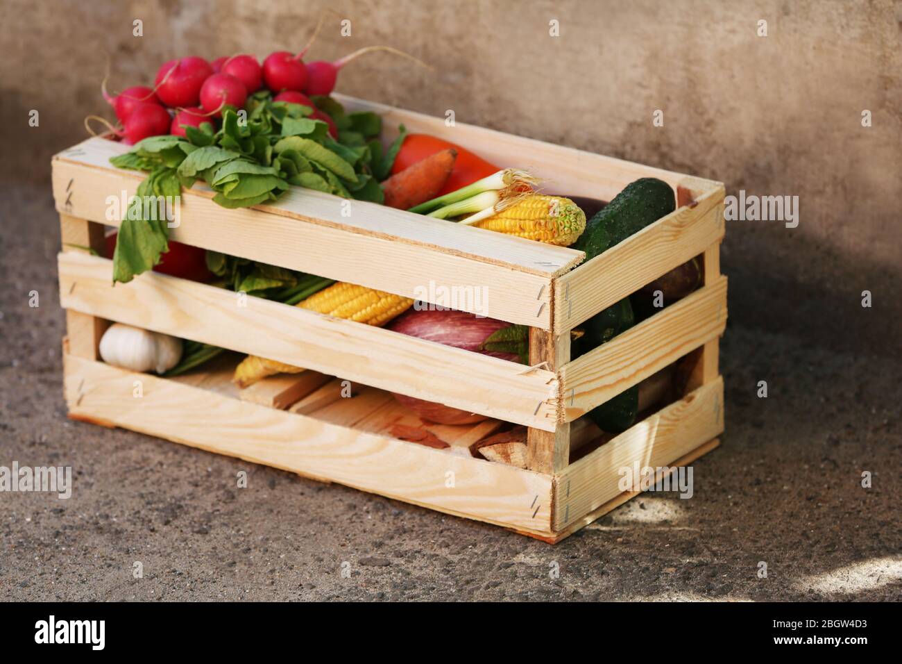 Fresh organic vegetables in wooden box outdoors Stock Photo - Alamy