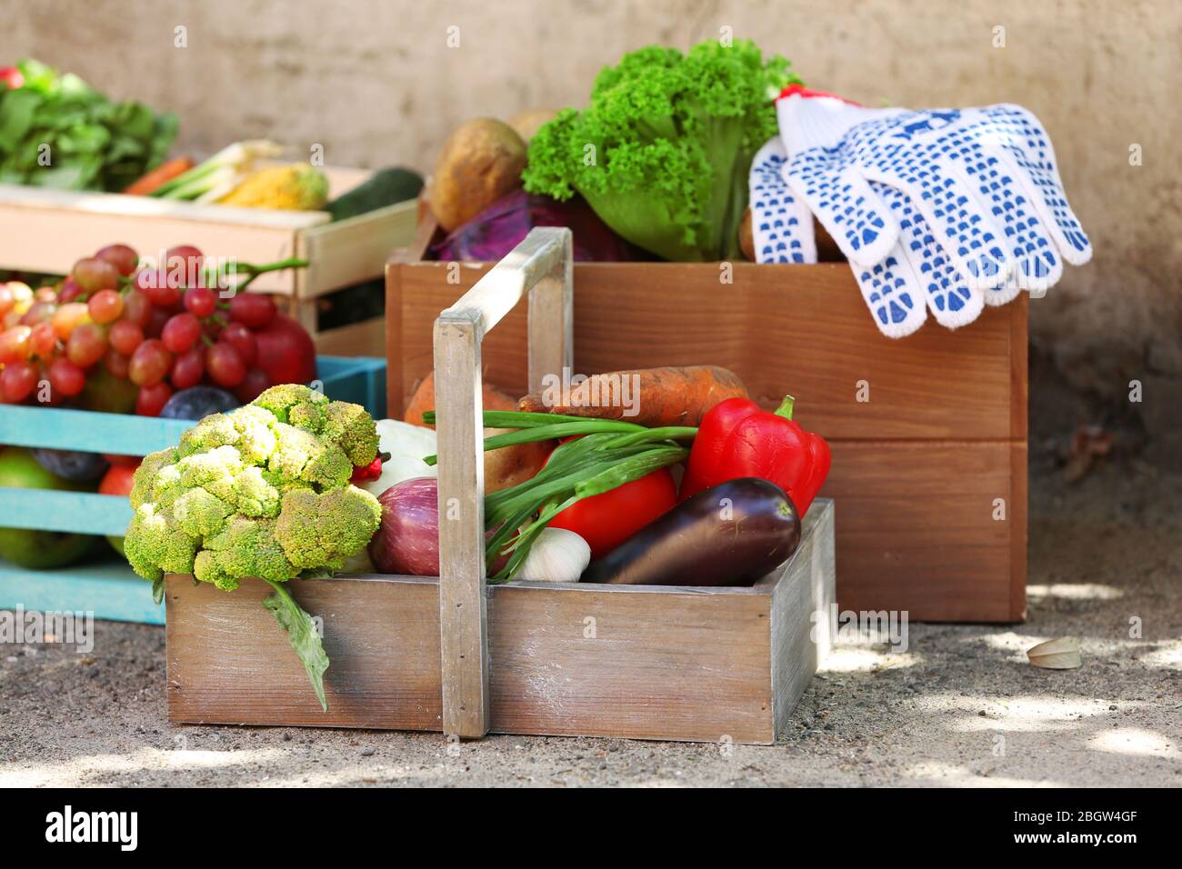 Fresh organic fruits and vegetables in wooden boxes outdoors Stock ...
