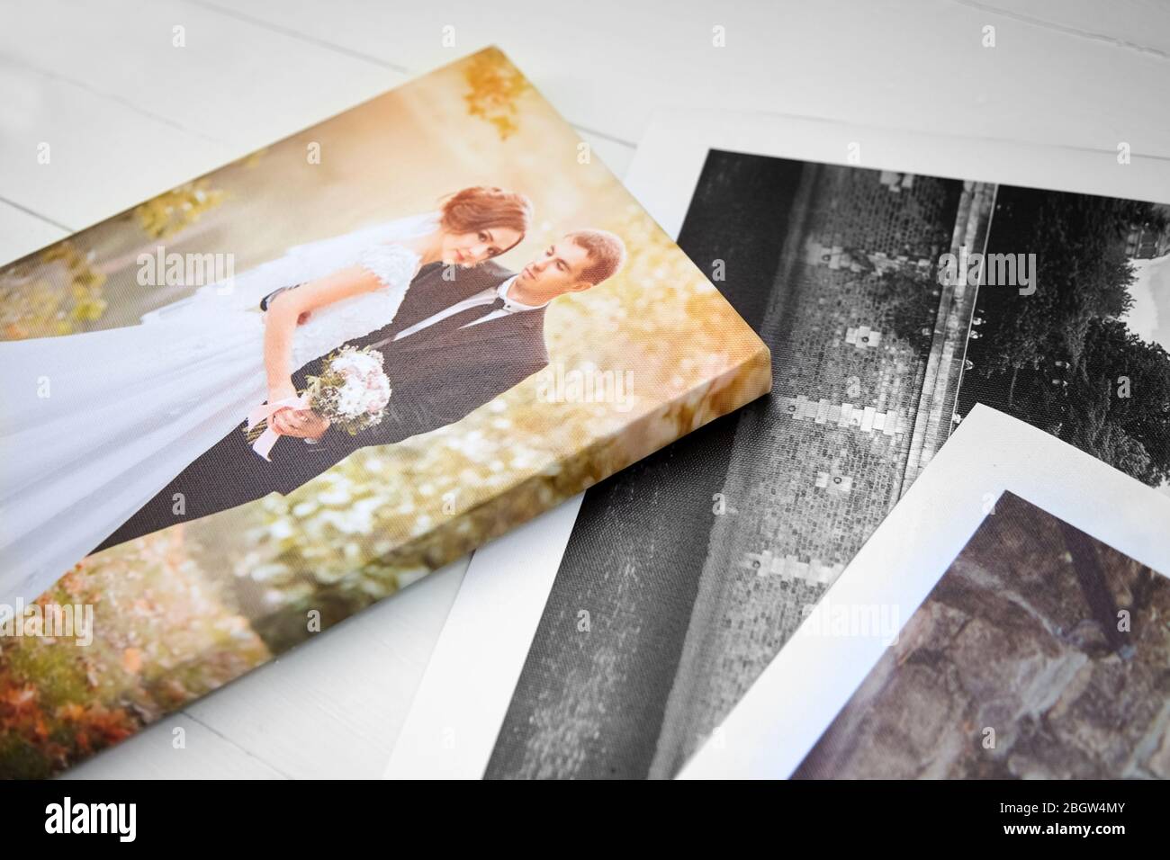 Wedding photo printed on canvas. Sample of stretched wedding photography with gallery wrapping. Canvas prints Stock Photo