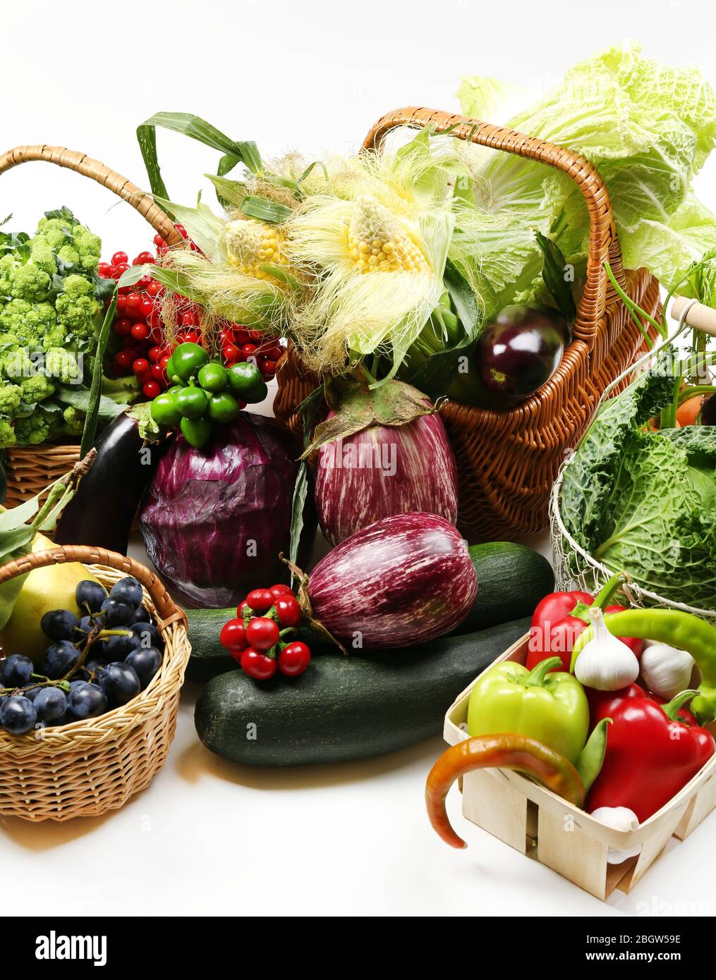 Fresh organic vegetables in wicker baskets, close up Stock Photo - Alamy