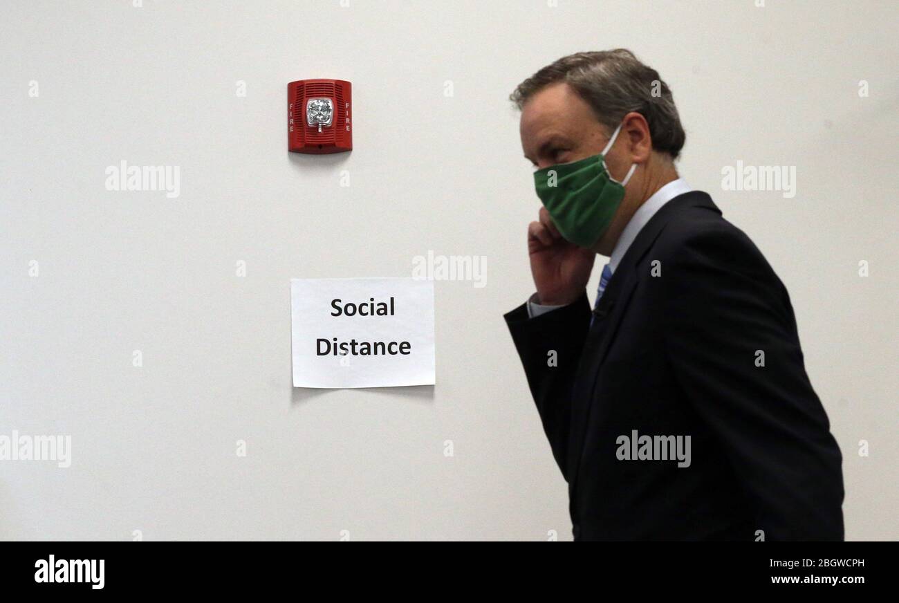 Clayton, United States. 22nd Apr, 2020. St. Louis County supervisor Dr. Sam Page prepares to remove his face mask before talking to reporters in Clayton, Missouri on Wednesday, April 22, 2020. Page announced that the stay-at-home order in St. Louis County is extended indefinitely. Presently, St. Louis County is reporting 96 total deaths from COVID-19 and 2,417 cases. Additionally, St. Louis County reports 672 recovered cases of the coronavirus. Photo by Bill Greenblatt/UPI Credit: UPI/Alamy Live News Stock Photo