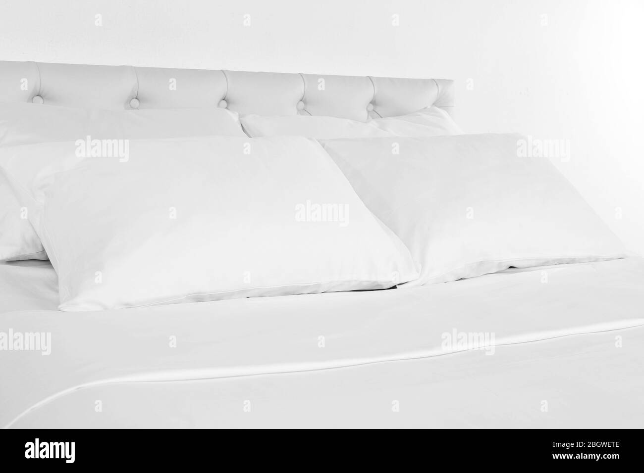 White pillows on bed in room Stock Photo Alamy