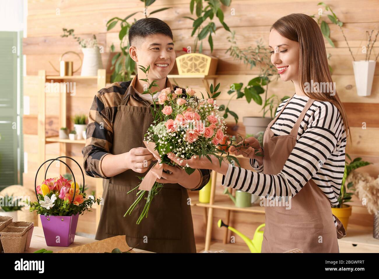 Man woman florists working together hi-res stock photography and images ...