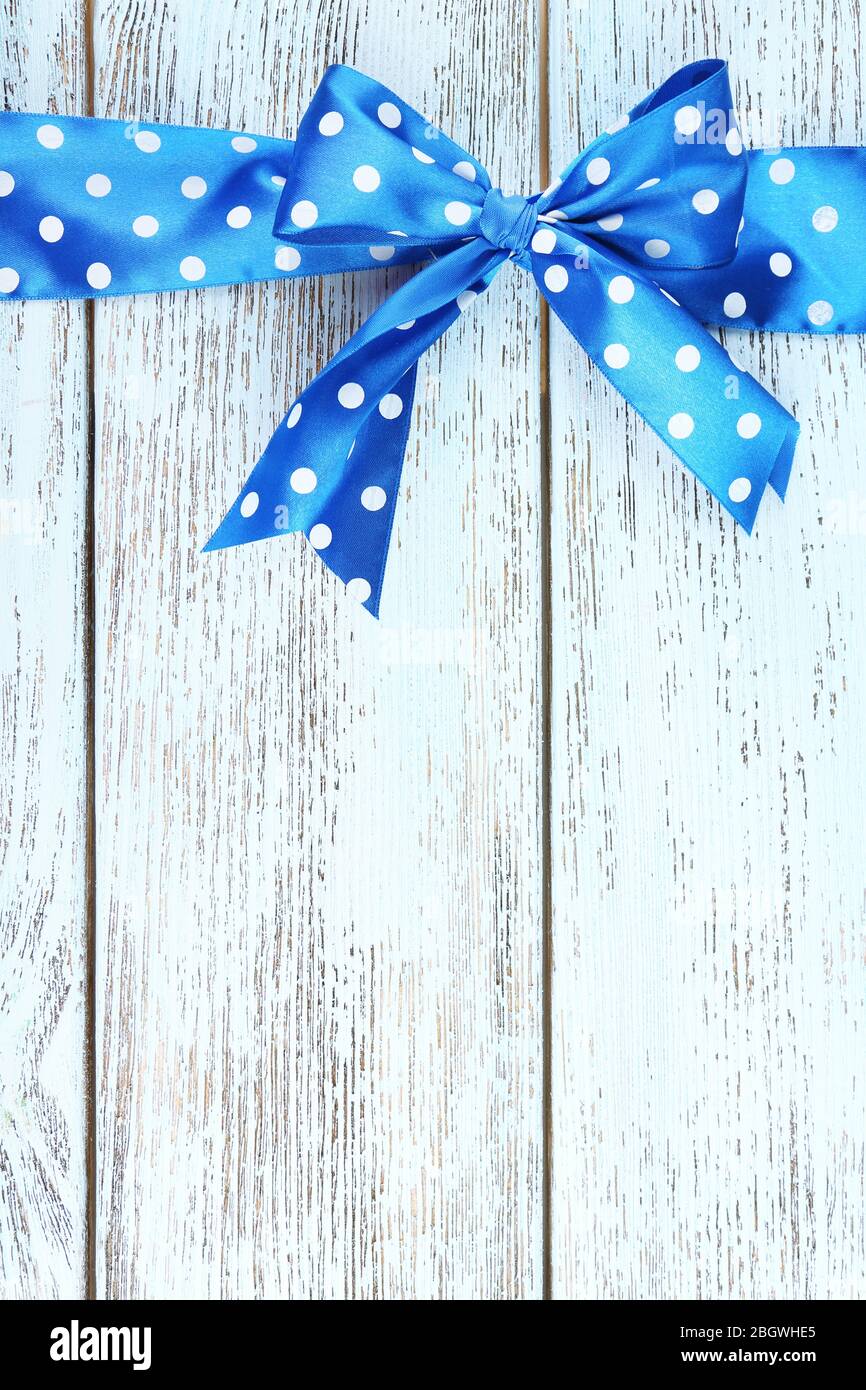Old wooden background with beautiful bow Stock Photo - Alamy