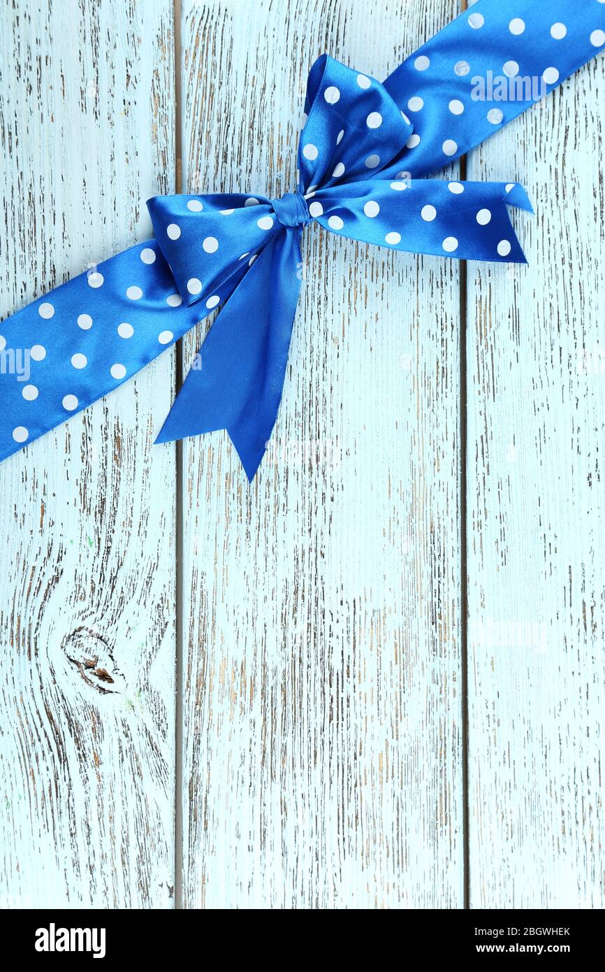Old wooden background with beautiful bow Stock Photo - Alamy