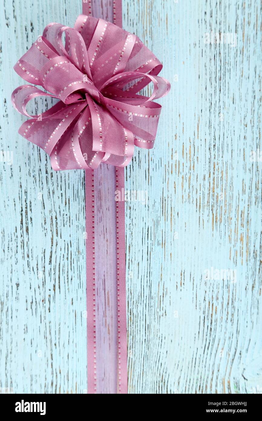 Old wooden background with beautiful bow Stock Photo - Alamy