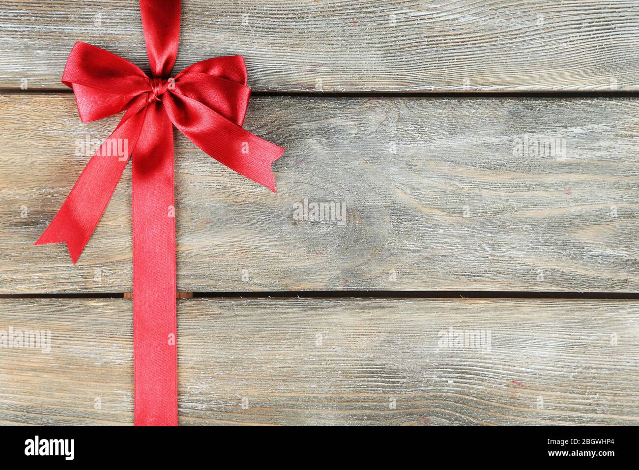 Old wooden background with beautiful bow Stock Photo - Alamy