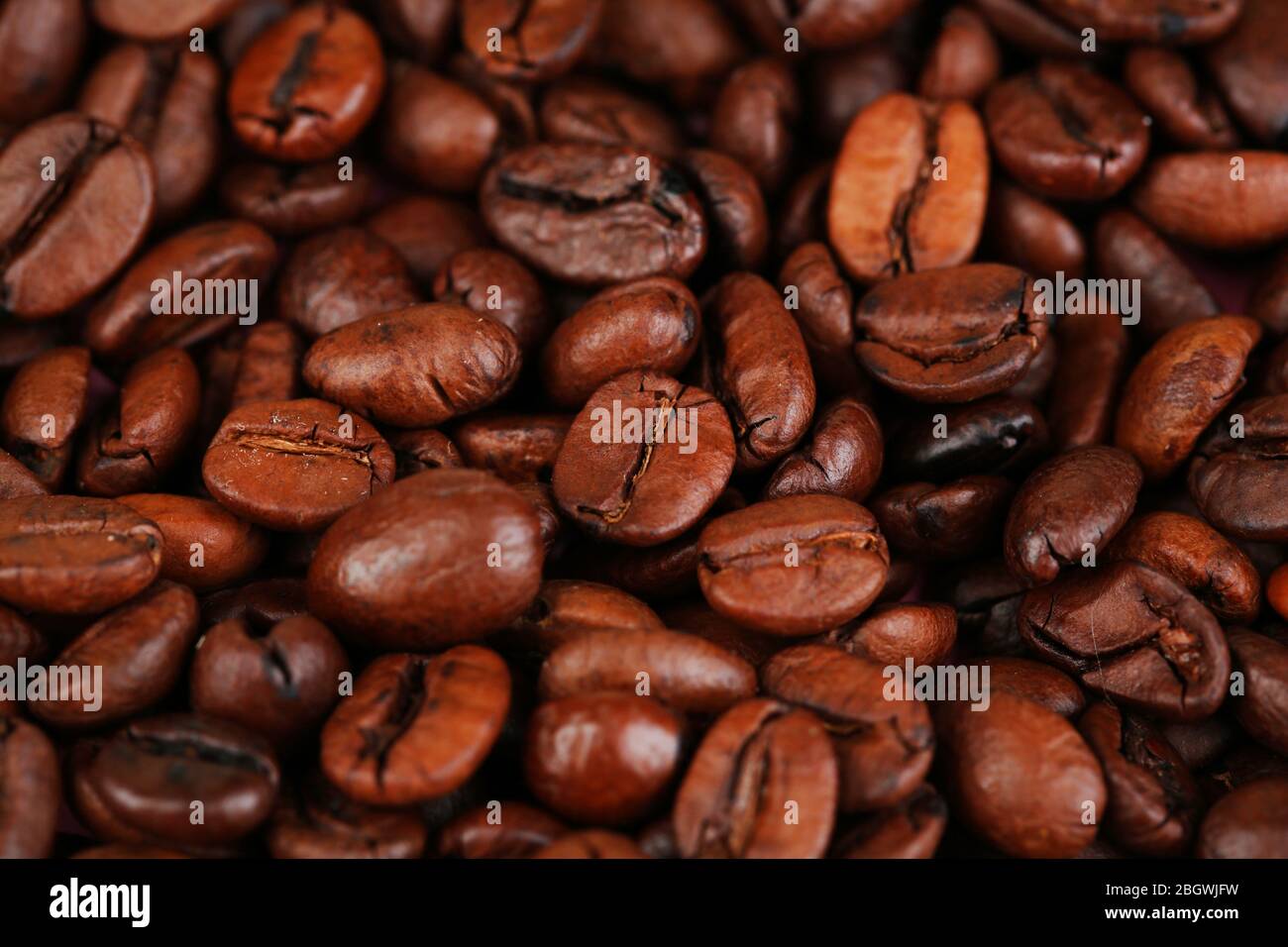 Roasted coffee beans background texture Stock Photo - Alamy
