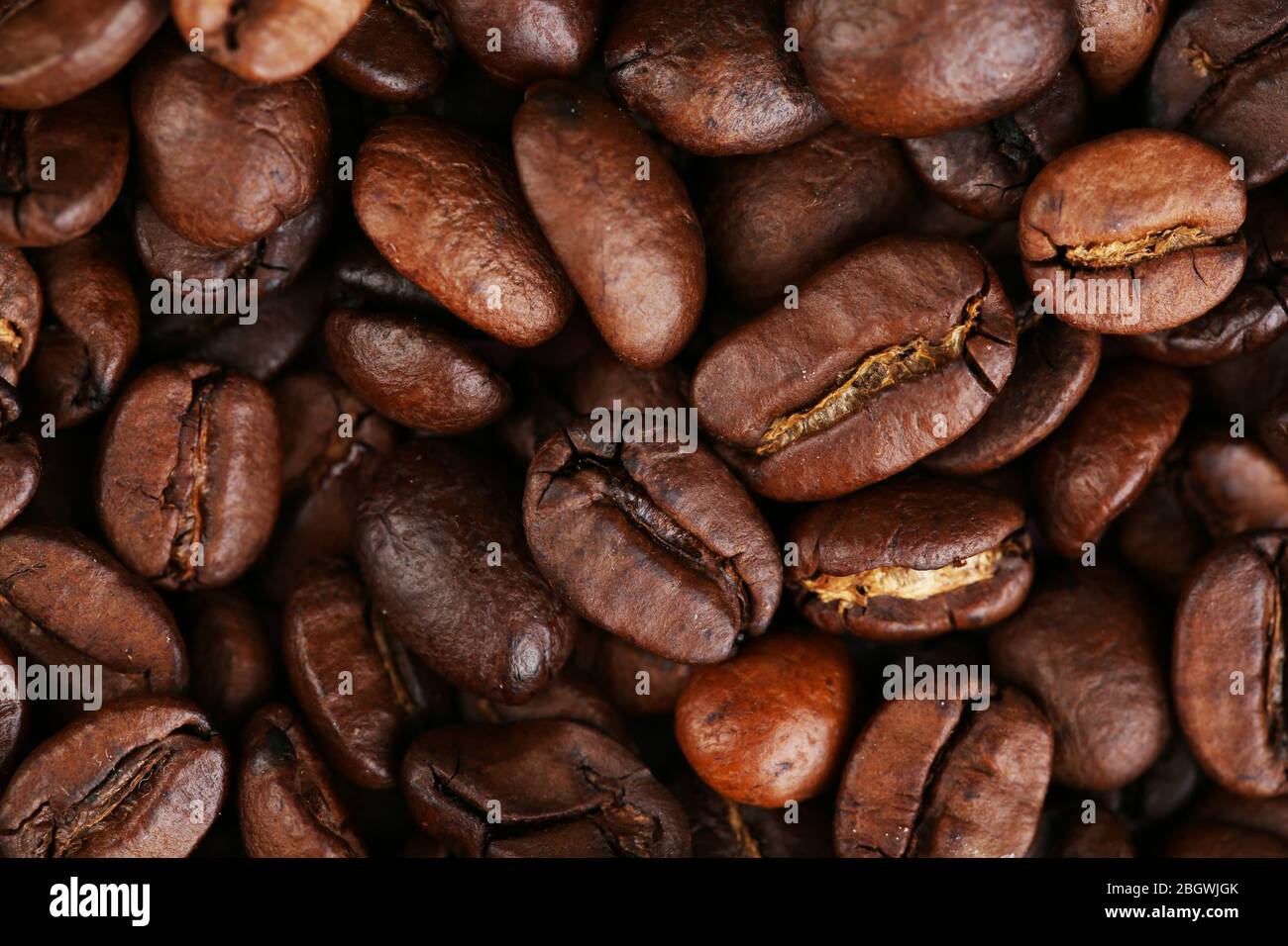 Roasted coffee beans background texture Stock Photo - Alamy