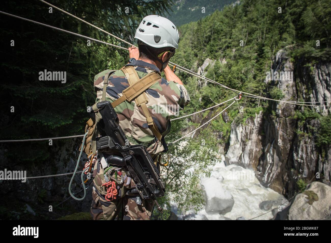 CHAMONIX, FRANCE JULY 02 a soldier getting ready for a zipline