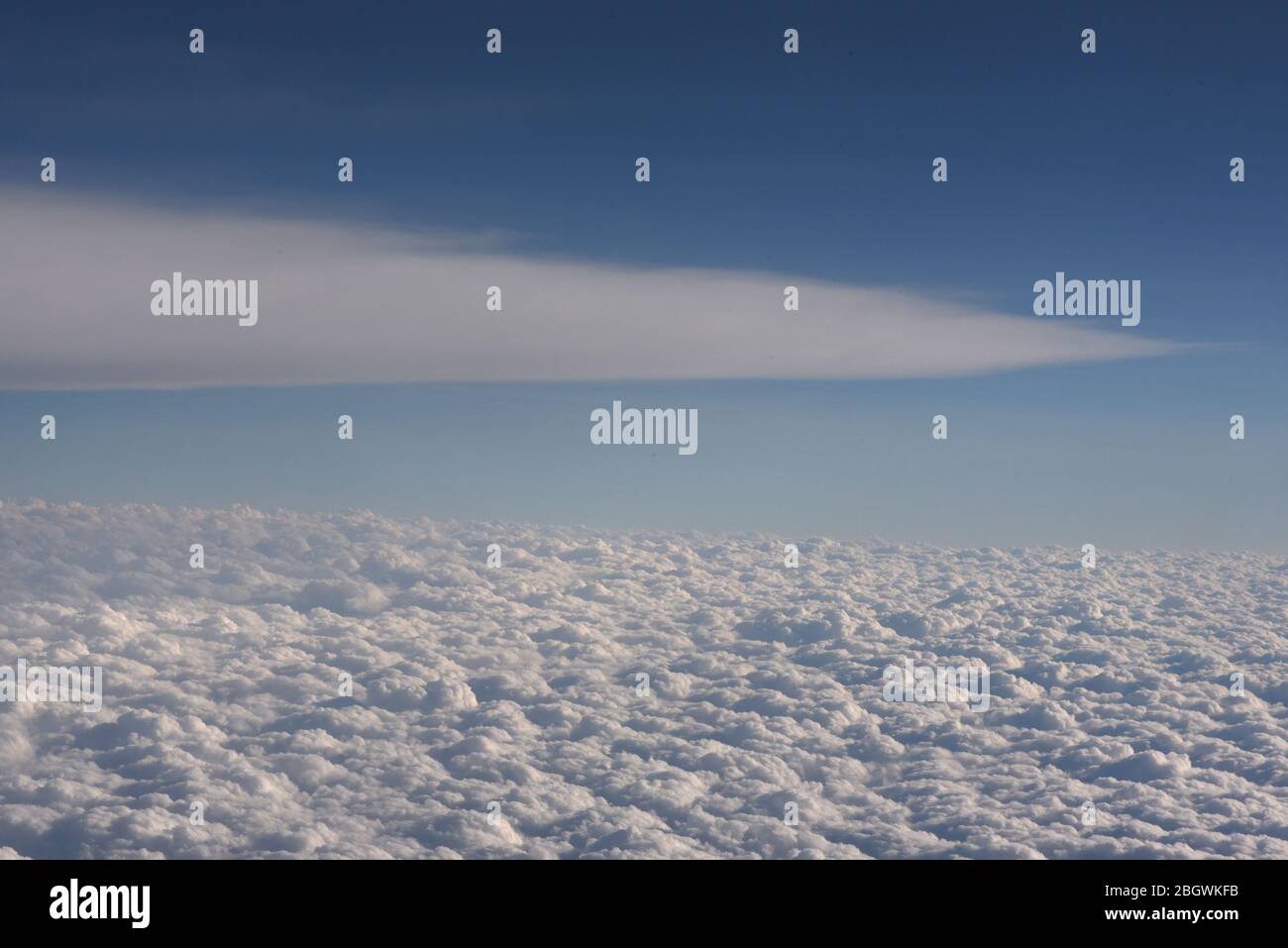 Horizontal image of a view of cloud formations from above, looking down from an airplane Stock Photo