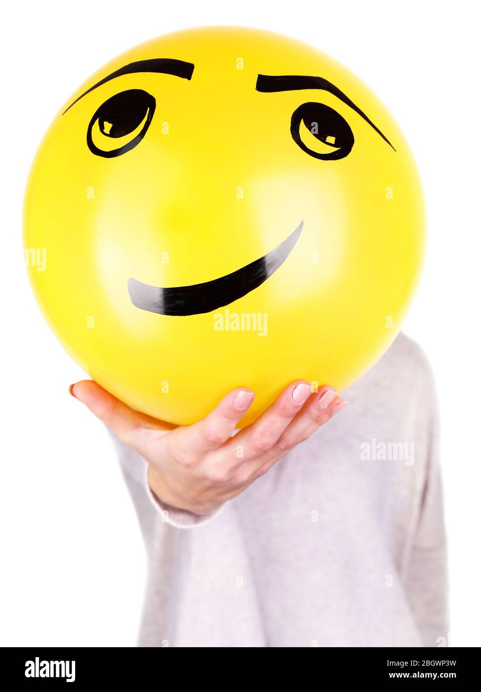 Woman holding balloon in front of her face Stock Photo - Alamy