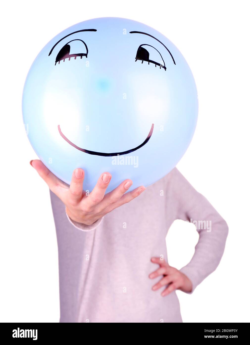 Woman holding balloon in front of her face Stock Photo - Alamy