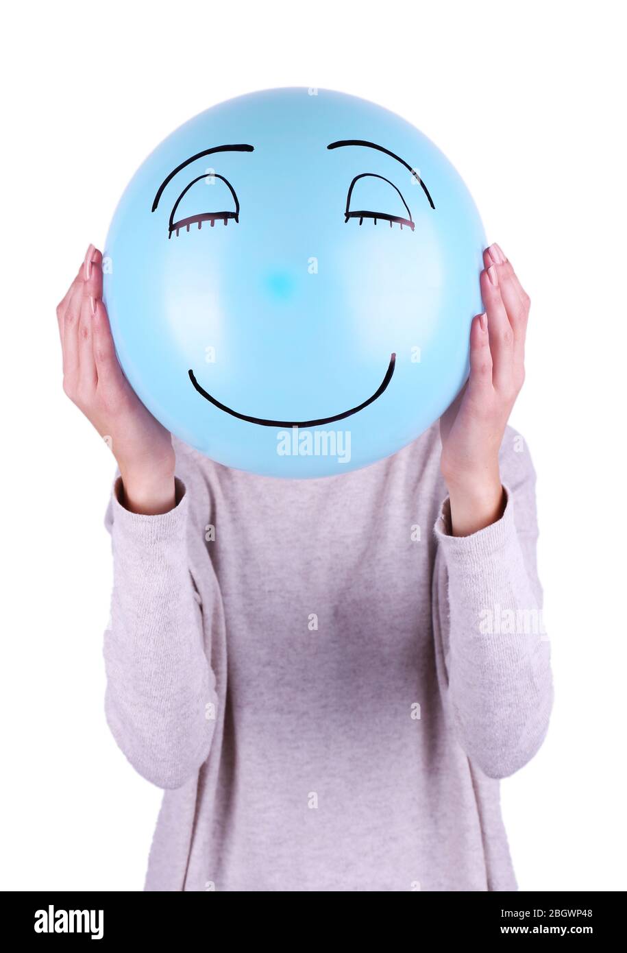 Woman holding balloon in front of her face Stock Photo - Alamy