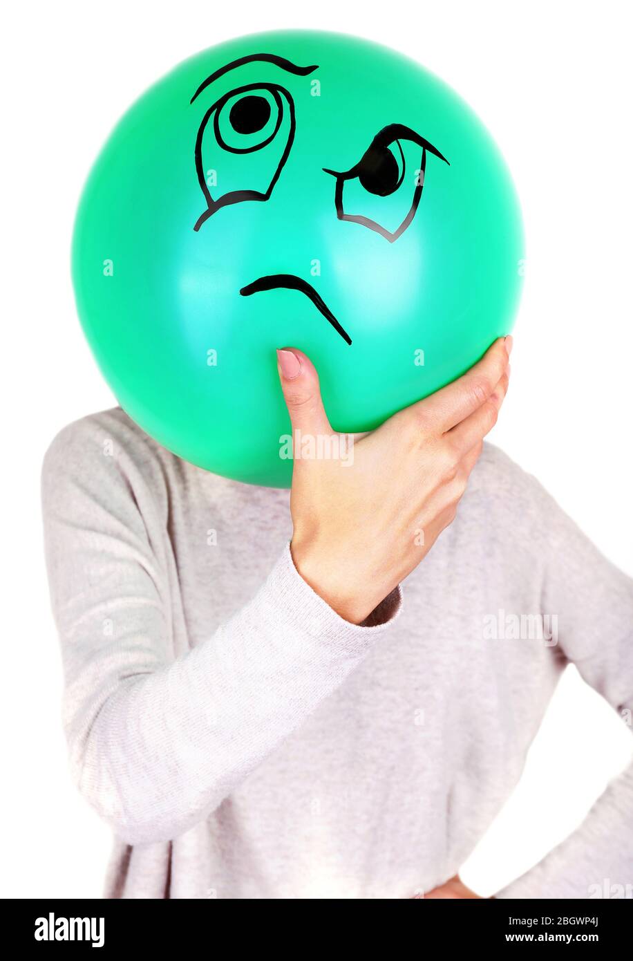 Woman holding balloon in front of her face Stock Photo - Alamy